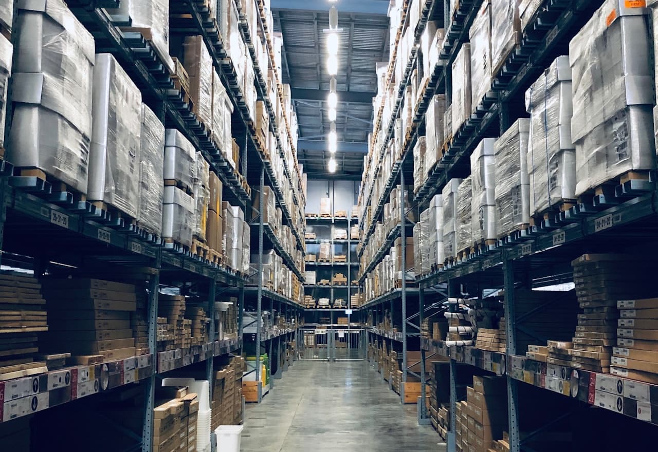 Aisles of stacked pallet racking in a wholesale warehouse