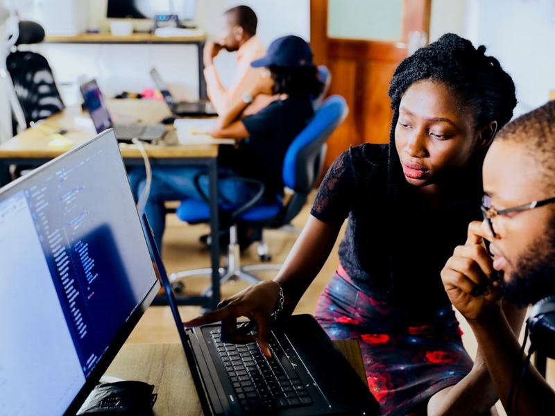 Engineers reviewing a systems integration in code